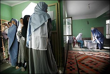 Afghan women voters line up to cast their ballots at a mosque made into a polling station in Kabul on Thursday Aug. 20, 2009. Afghans voted under the shadow of Taliban threats of violence Thursday to choose their next president for a nation plagued by armed insurgency, drugs, corruption and a feeble government nearly eight years after the U.S.-led invasion. (AP Photo/David Guttenfelder)
